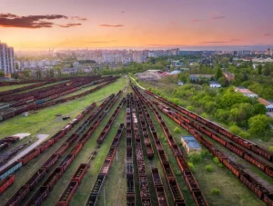 aerial view of freight trains at sunset