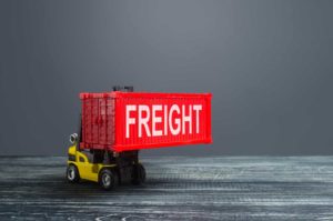 toy truck lifting intermodal freight container
