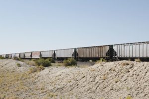 intermodal containers on a train going through the dessert