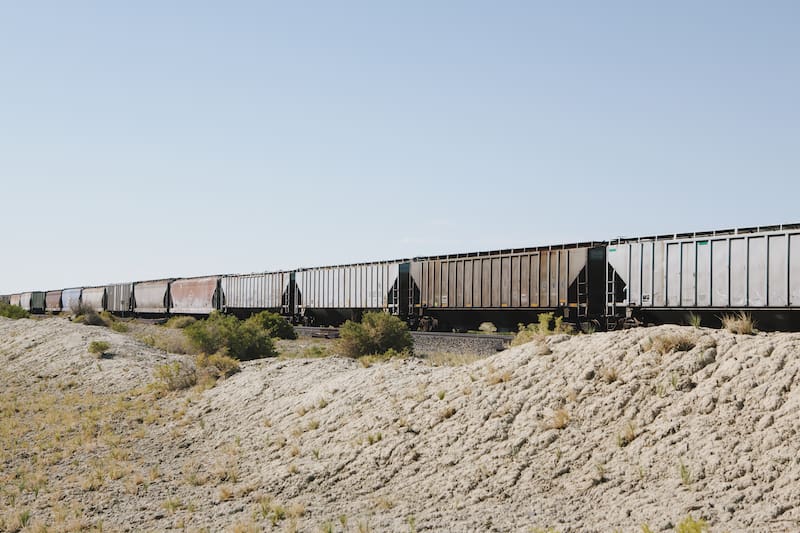 intermodal containers on a train going through the dessert