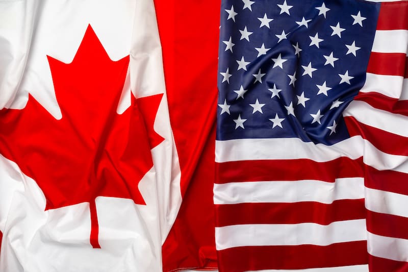 Canada and US Flags folded next to each other