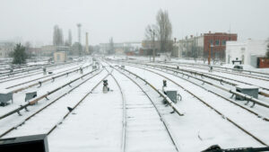 train tracks in winter covered in snow