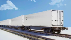 a white reefer container on a rail track